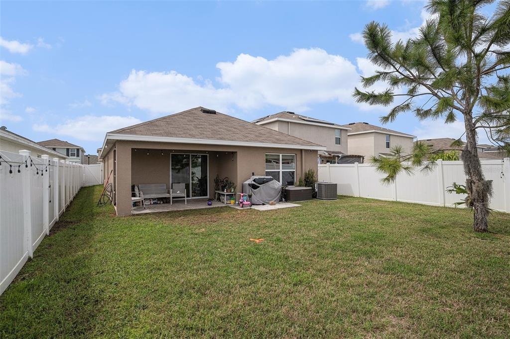 429 Olive Conch Street Ruskin, FL 33570 - Photo 11 of 15 a view of a house with backyard porch and furniture