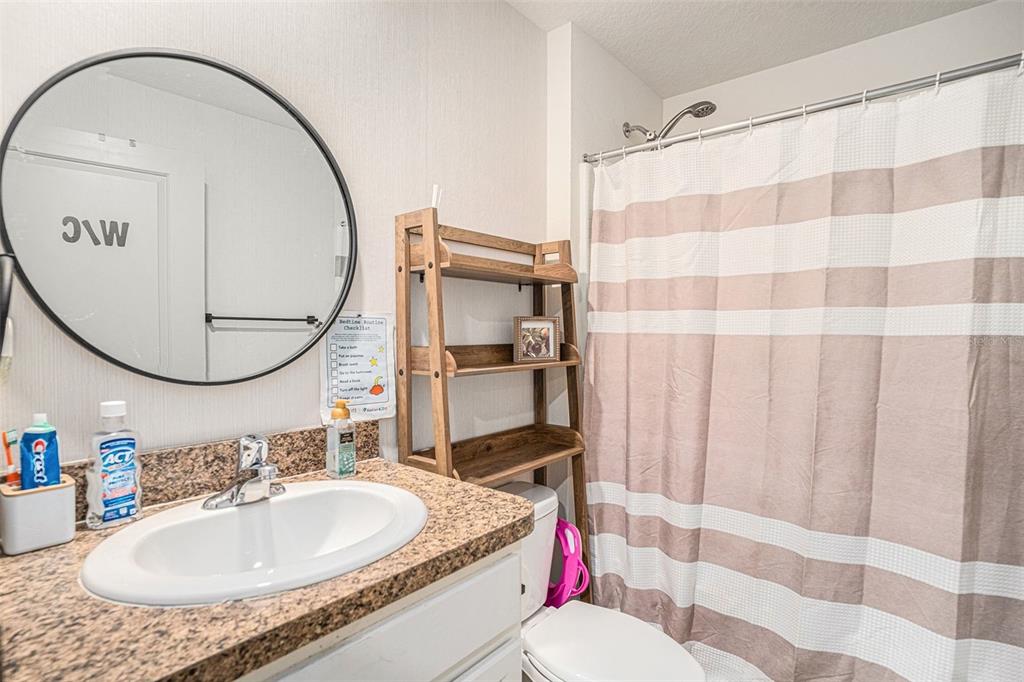429 Olive Conch Street Ruskin, FL 33570 - Photo 9 of 15 a bathroom with a sink and a mirror