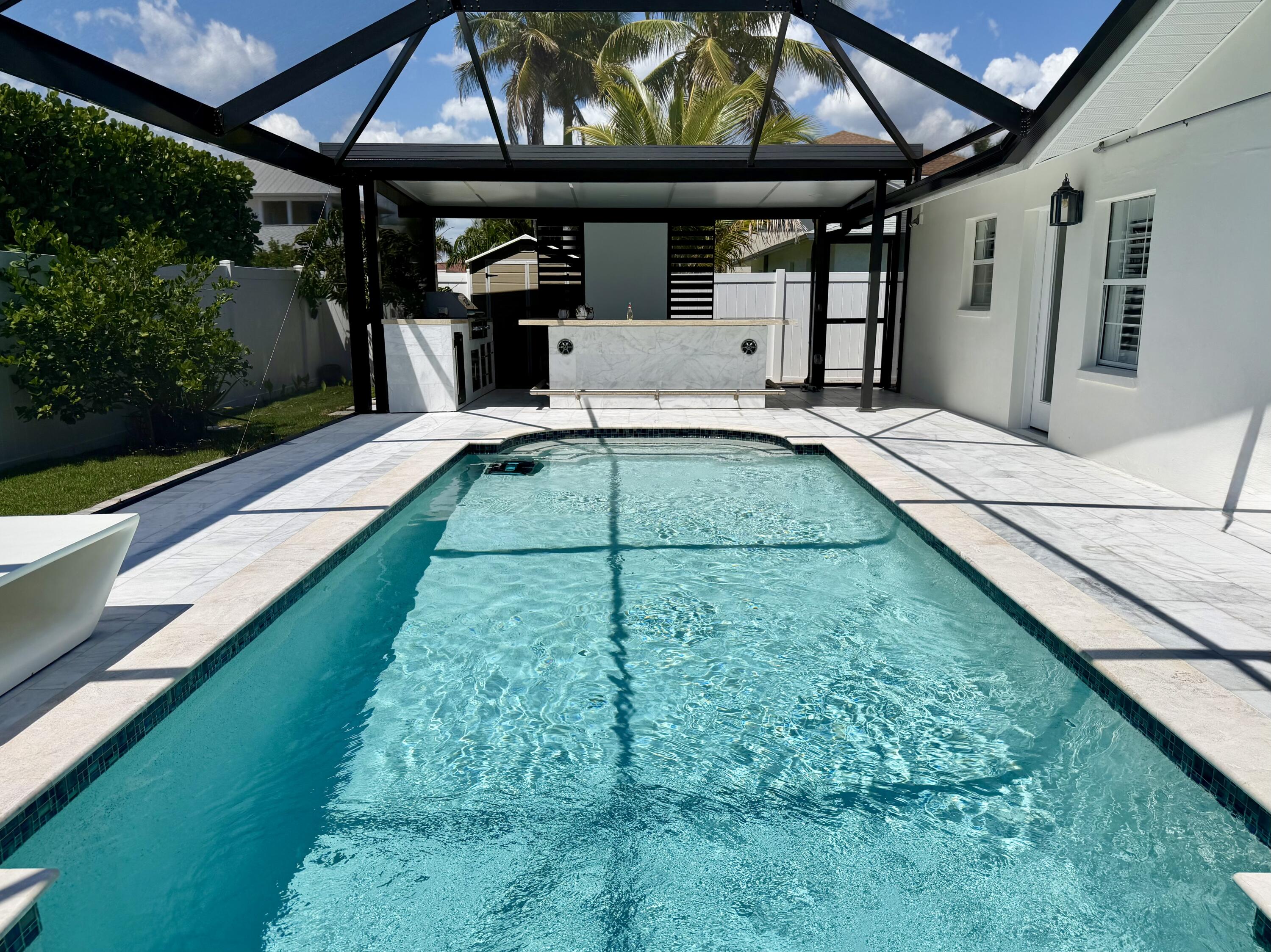 112 Capri Boulevard Naples, FL 34113 - Photo 22 of 29 a view of a backyard