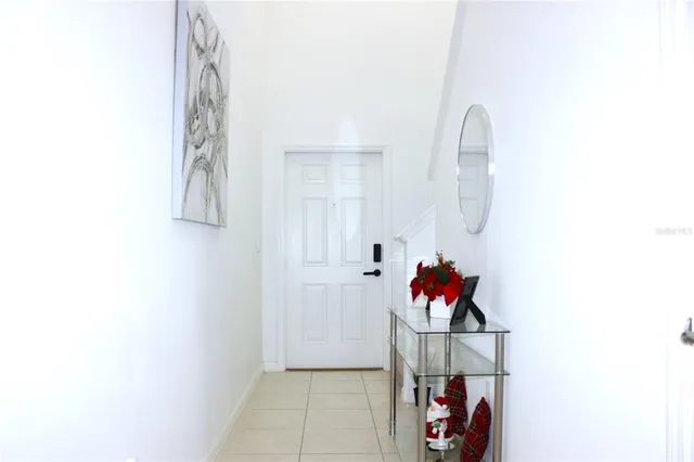 a living room with furniture and flowers