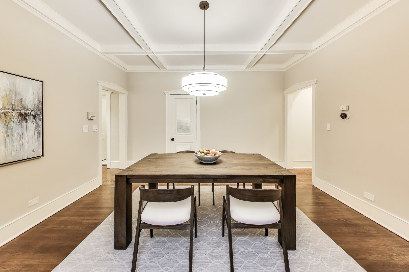 628 West Grace Street, Unit 2W Chicago, IL 60613 - Photo 12 of 32 a dining room with furniture and wooden floor