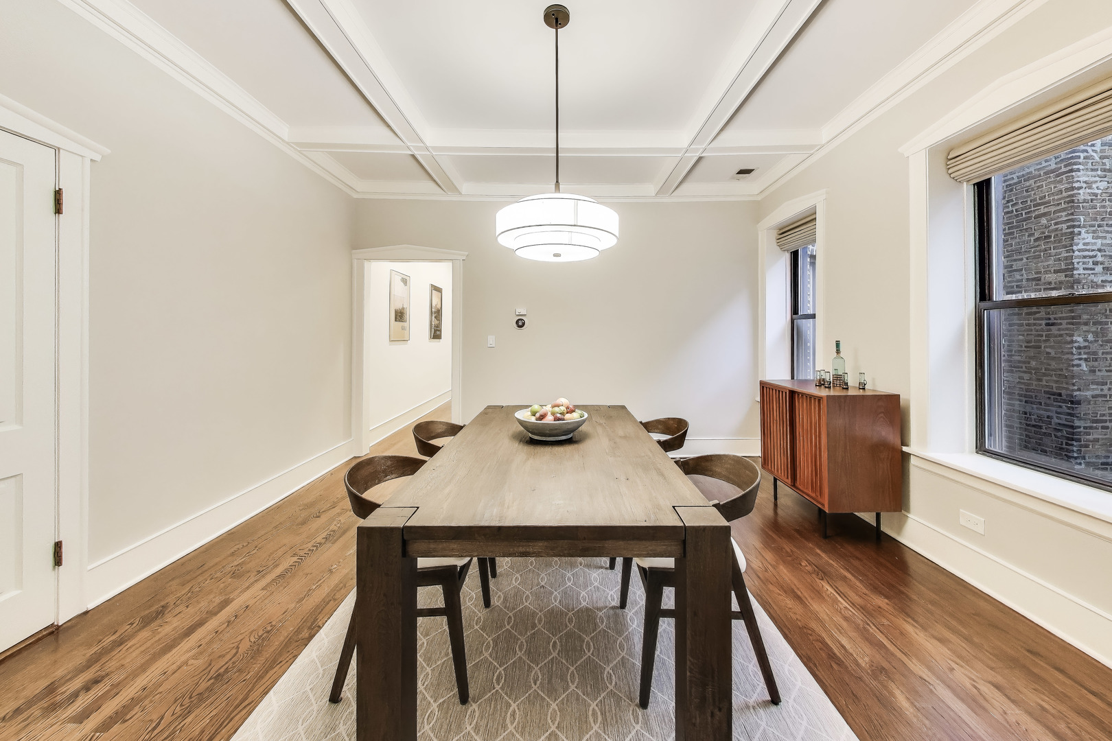 628 West Grace Street, Unit 2W Chicago, IL 60613 - Photo 13 of 32 a view of a dining room with furniture window and wooden floor