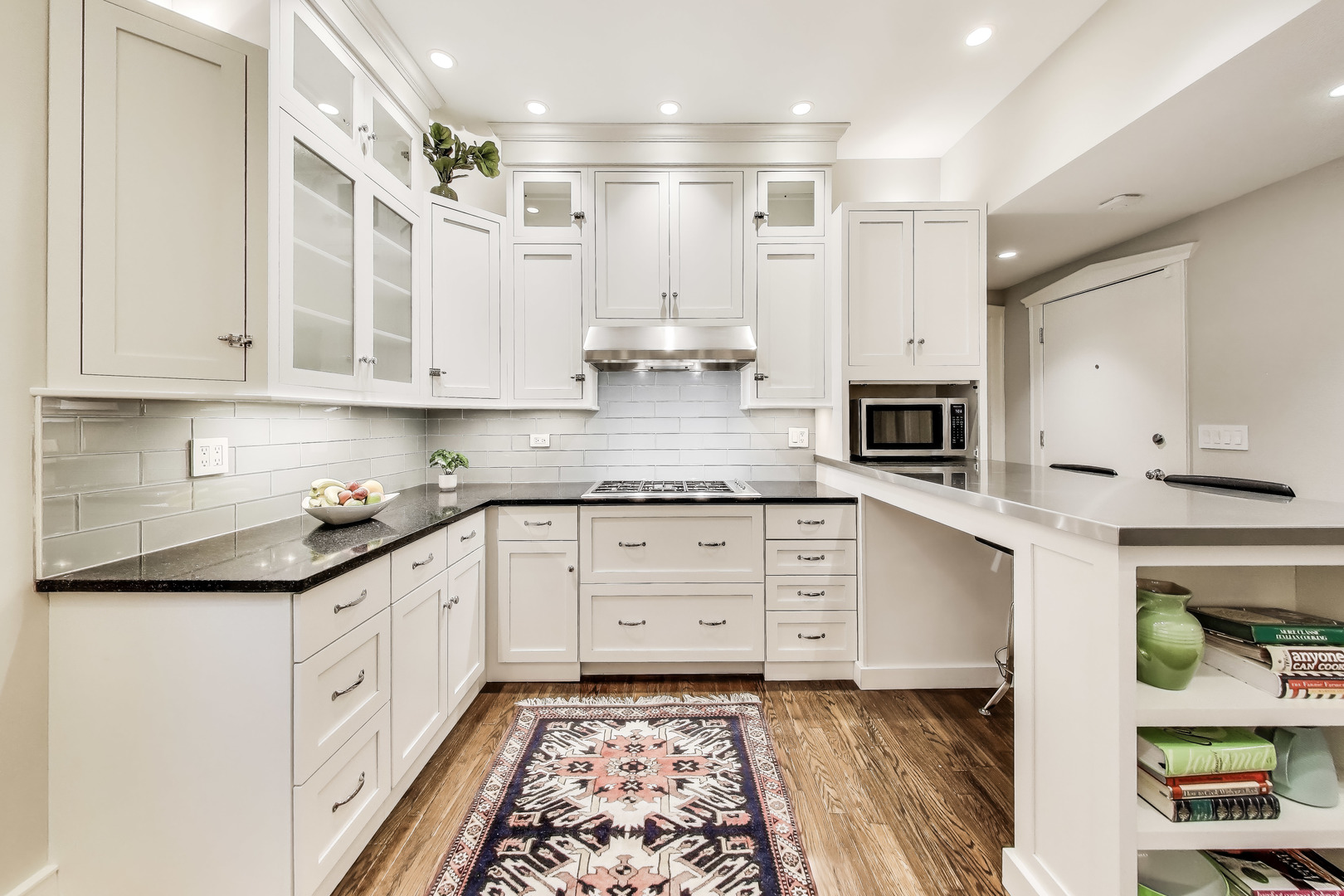 628 West Grace Street, Unit 2W Chicago, IL 60613 - Photo 15 of 32 a kitchen with stainless steel appliances granite countertop a sink and cabinets