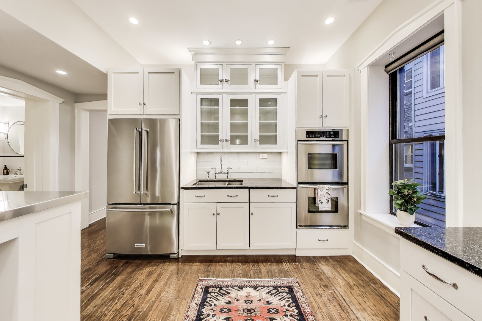 628 West Grace Street, Unit 2W Chicago, IL 60613 - Photo 16 of 32 a kitchen with stainless steel appliances a refrigerator and a stove top oven