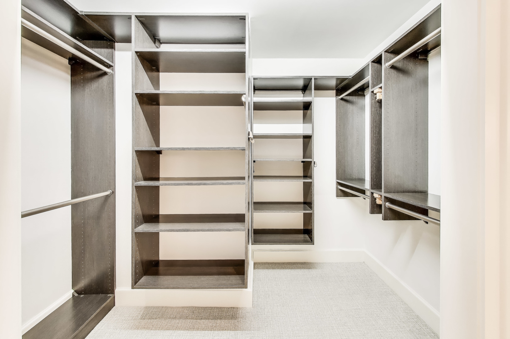 628 West Grace Street, Unit 2W Chicago, IL 60613 - Photo 23 of 32 a view of walk in closet with empty racks