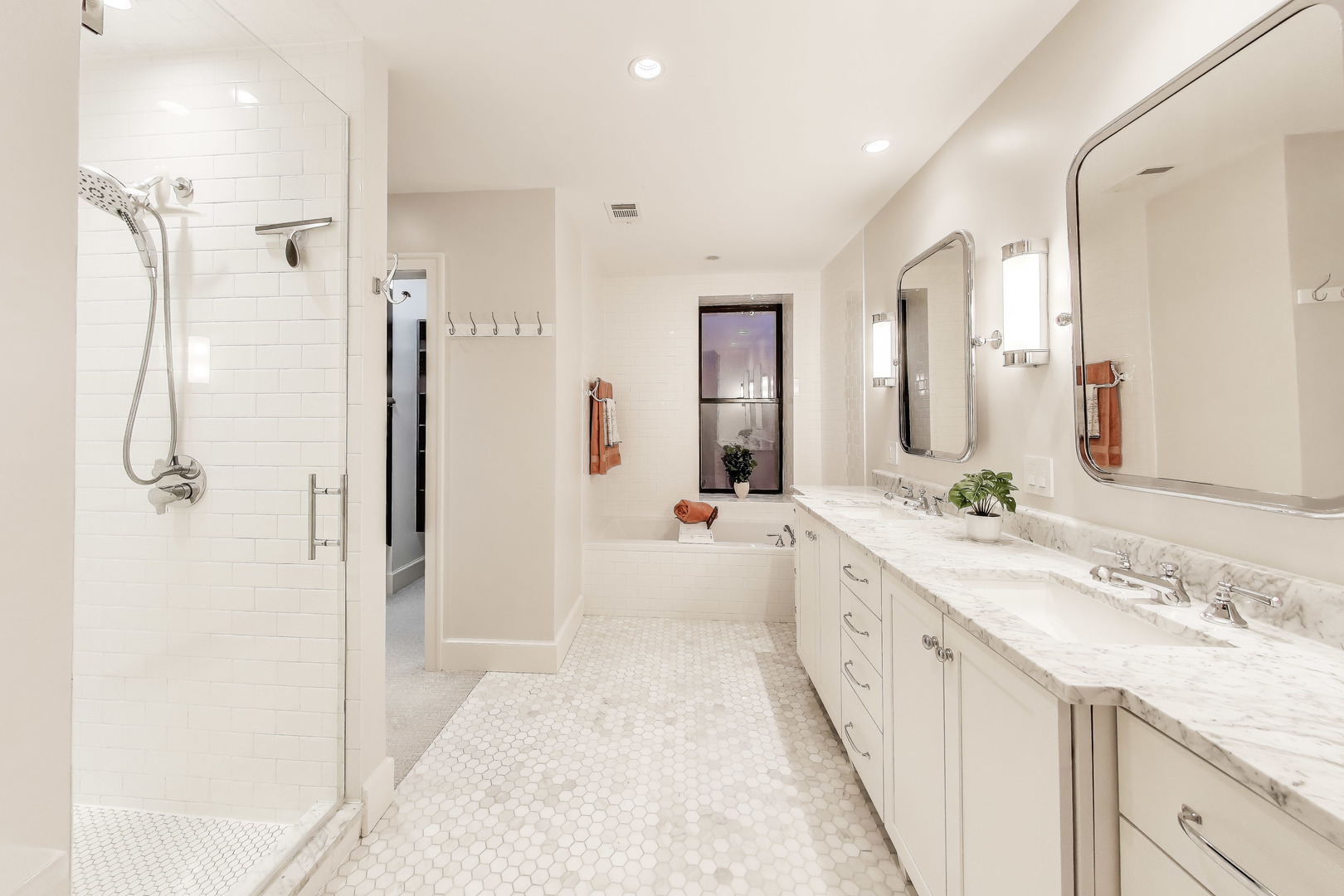 628 West Grace Street, Unit 2W Chicago, IL 60613 - Photo 25 of 32 a spacious bathroom with a double vanity sink mirror double and shower