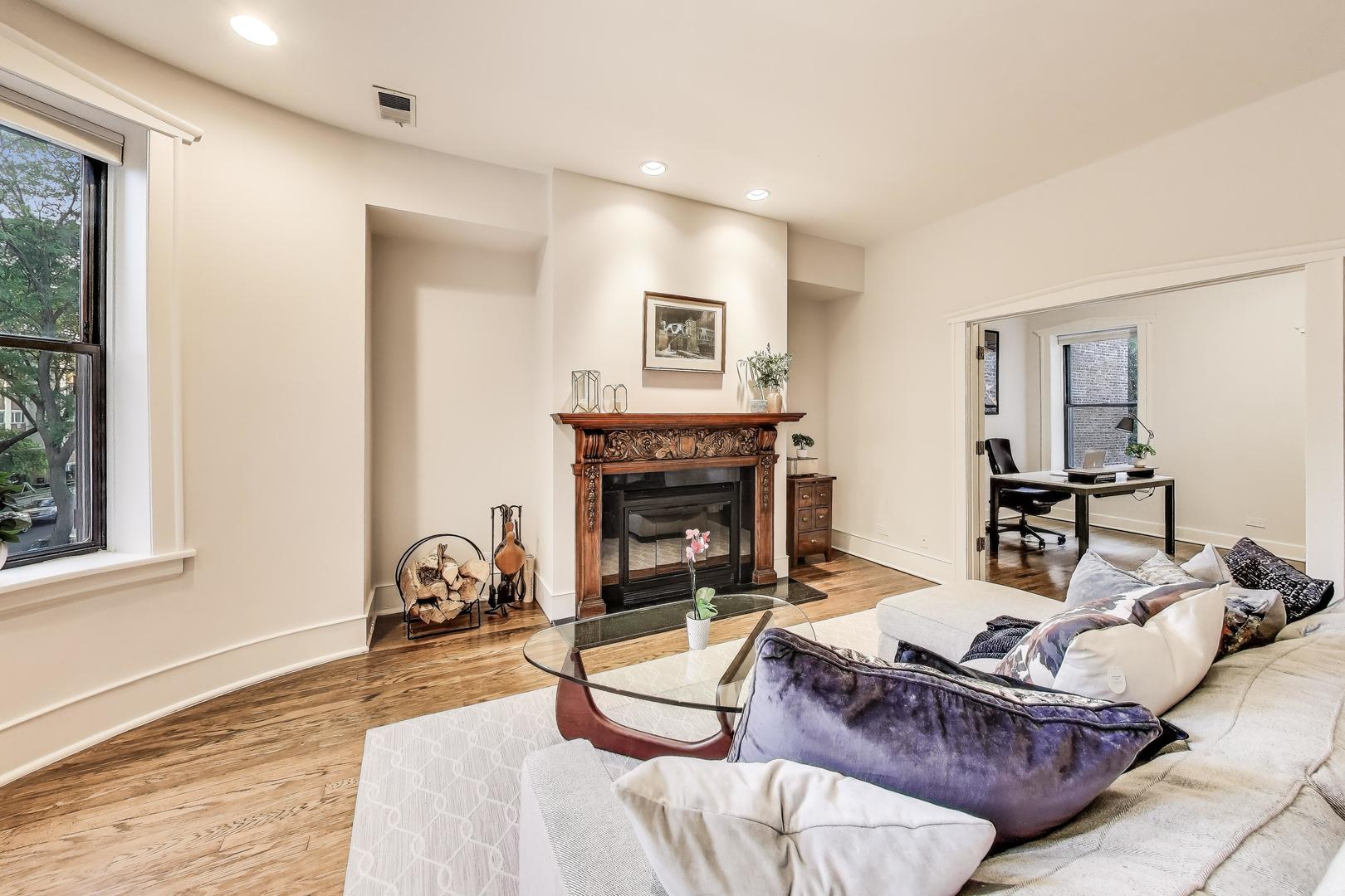 628 West Grace Street, Unit 2W Chicago, IL 60613 - Photo 7 of 32 a living room with furniture and a fireplace