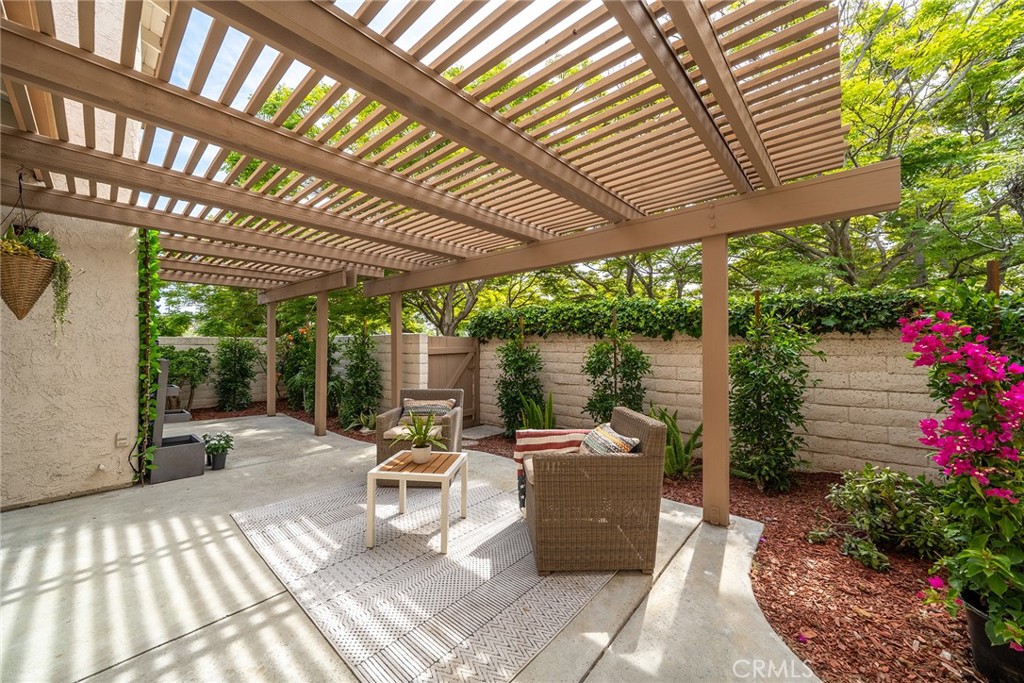 10 Lassen Irvine, CA 92612 - Photo 4 of 15 a view of a patio with table and chairs potted plants and large tree