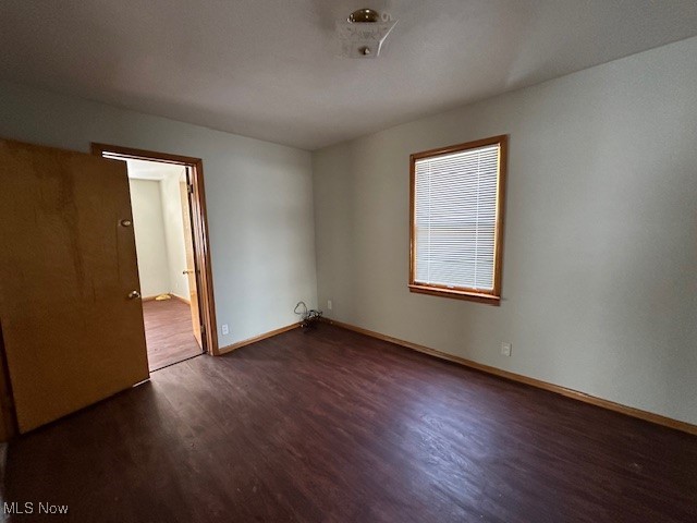 1913 Coltman Road Cleveland, OH 44106 - Photo 18 of 32 Empty room featuring dark wood-type flooring