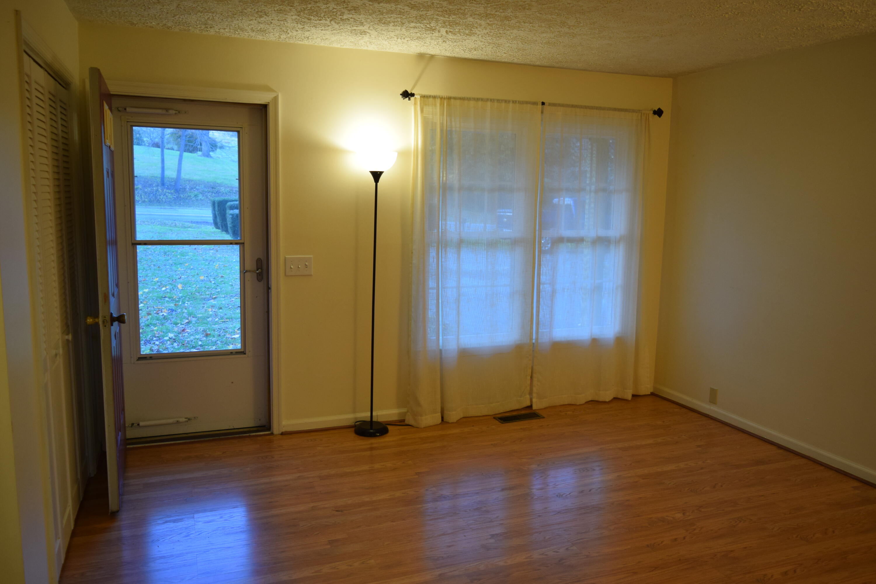 162 Ridgeview Road Northwest Floyd, VA 24091 - Photo 16 of 47 an empty room with wooden floor and windows