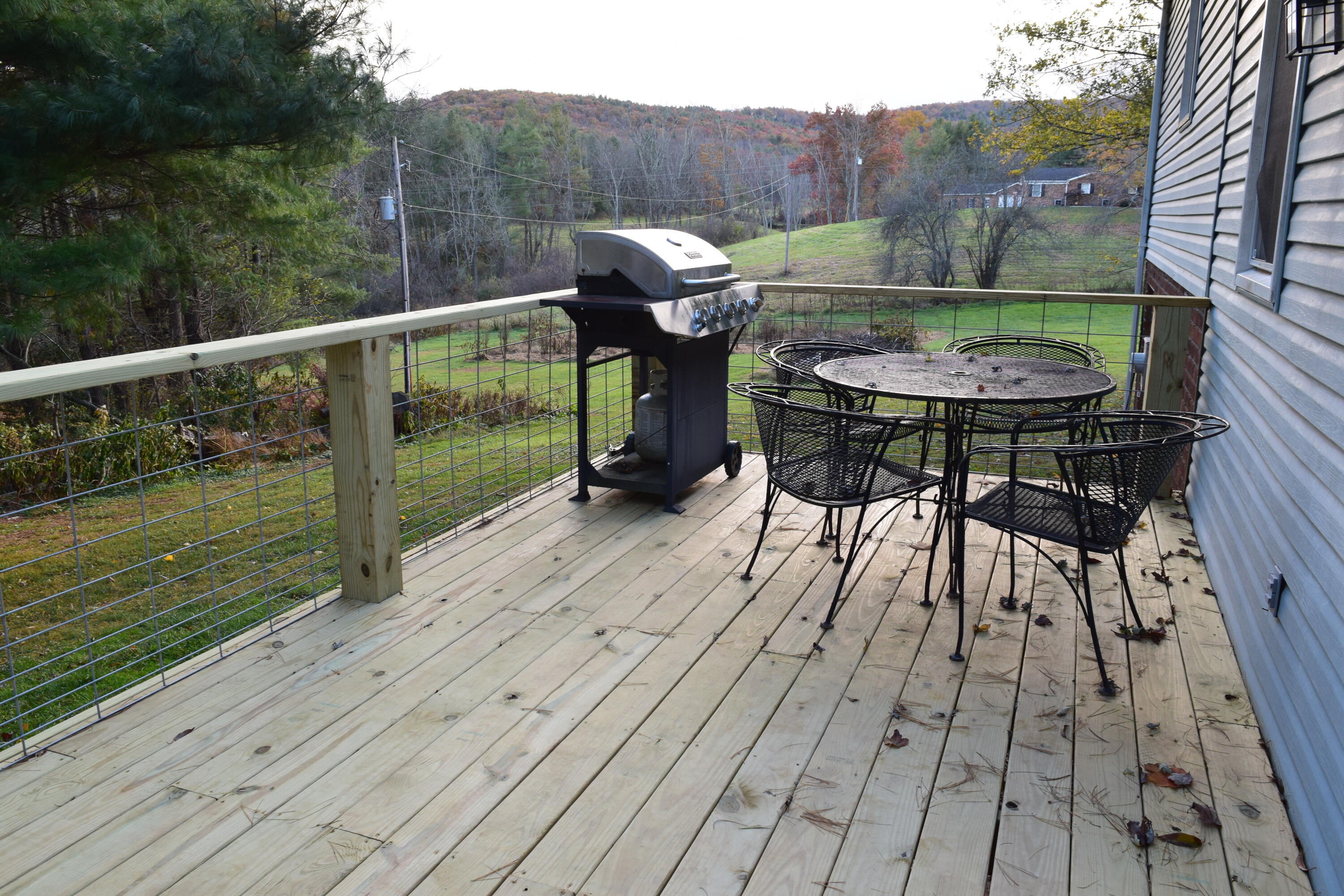 162 Ridgeview Road Northwest Floyd, VA 24091 - Photo 40 of 47 a view of a chairs and table on the wooden deck