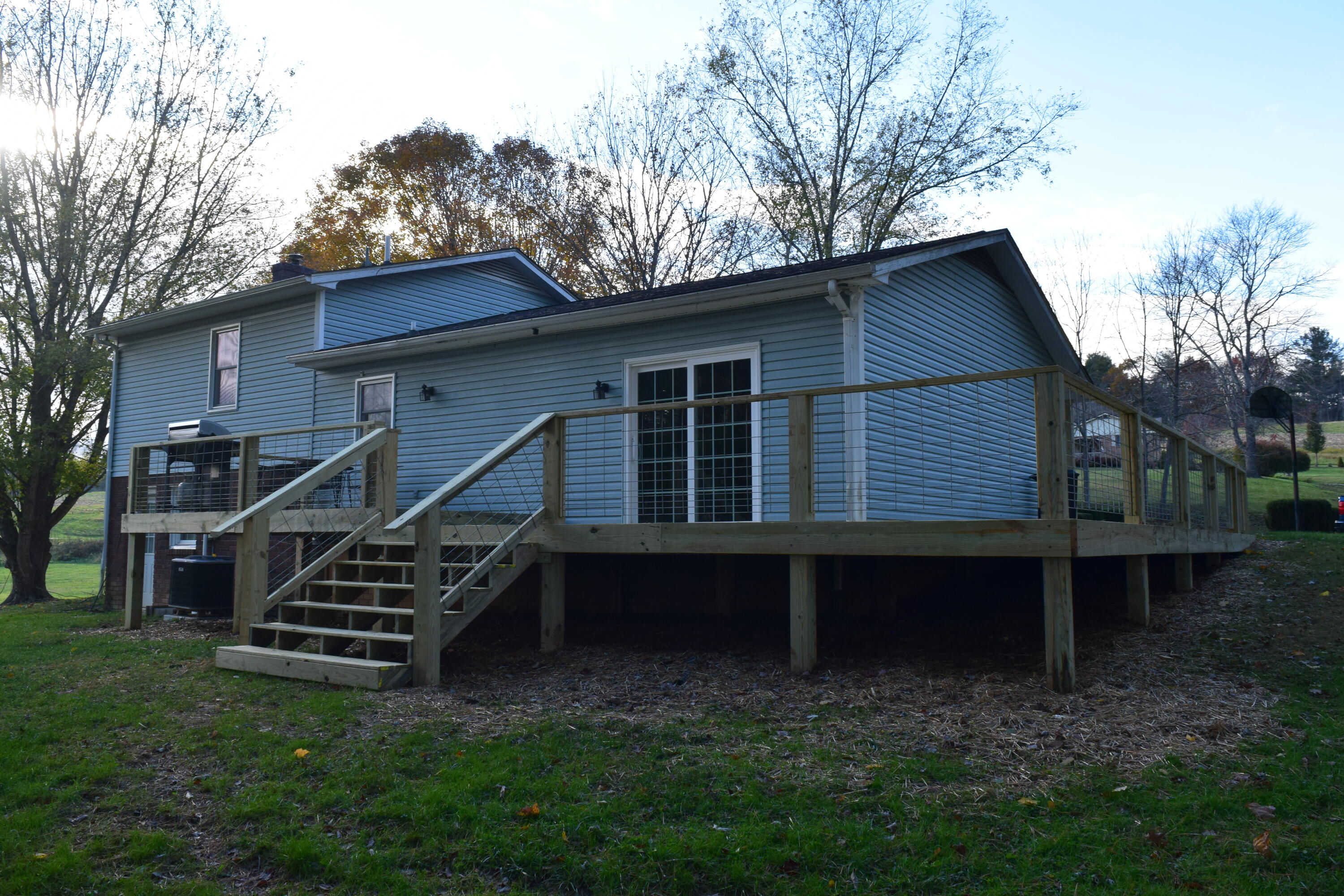 162 Ridgeview Road Northwest Floyd, VA 24091 - Photo 5 of 47 a backyard of a house with wooden stairs and fence