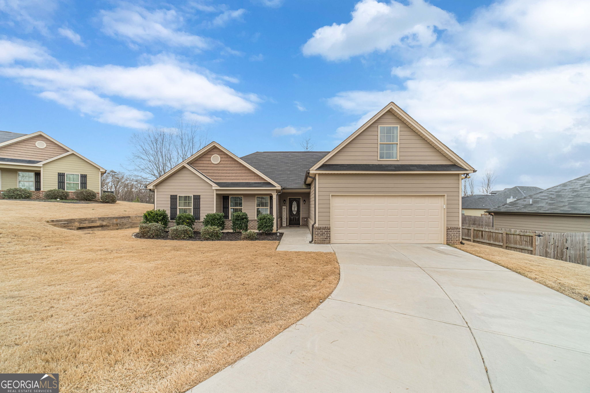 149 Peak Court Winder, GA 30680 - Photo 1 of 27 a front view of a house with a yard and garage