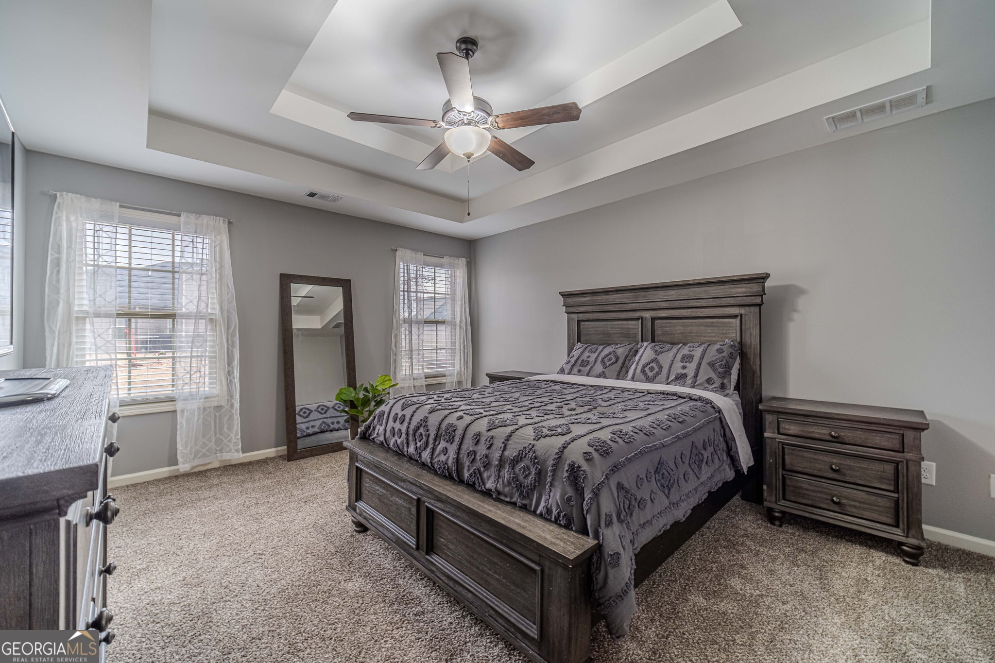 149 Peak Court Winder, GA 30680 - Photo 12 of 27 a bedroom with a bed dresser and a window