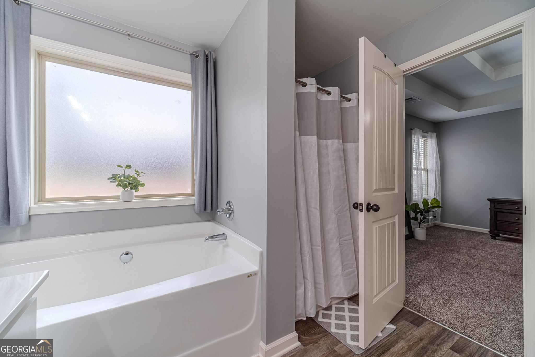 149 Peak Court Winder, GA 30680 - Photo 16 of 27 a bathroom with a bathtub and a shower