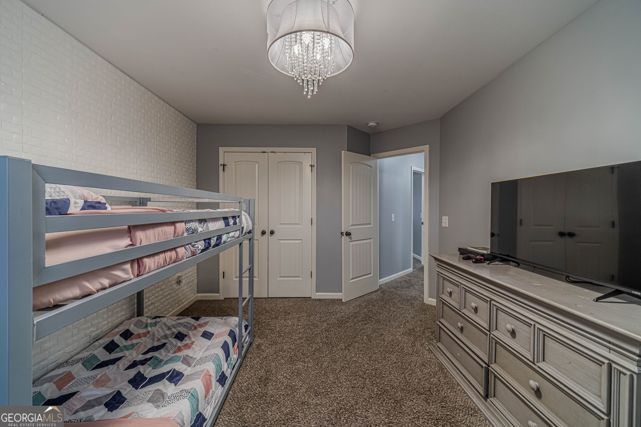 149 Peak Court Winder, GA 30680 - Photo 17 of 27 a view of a room with baby and a ceiling fan
