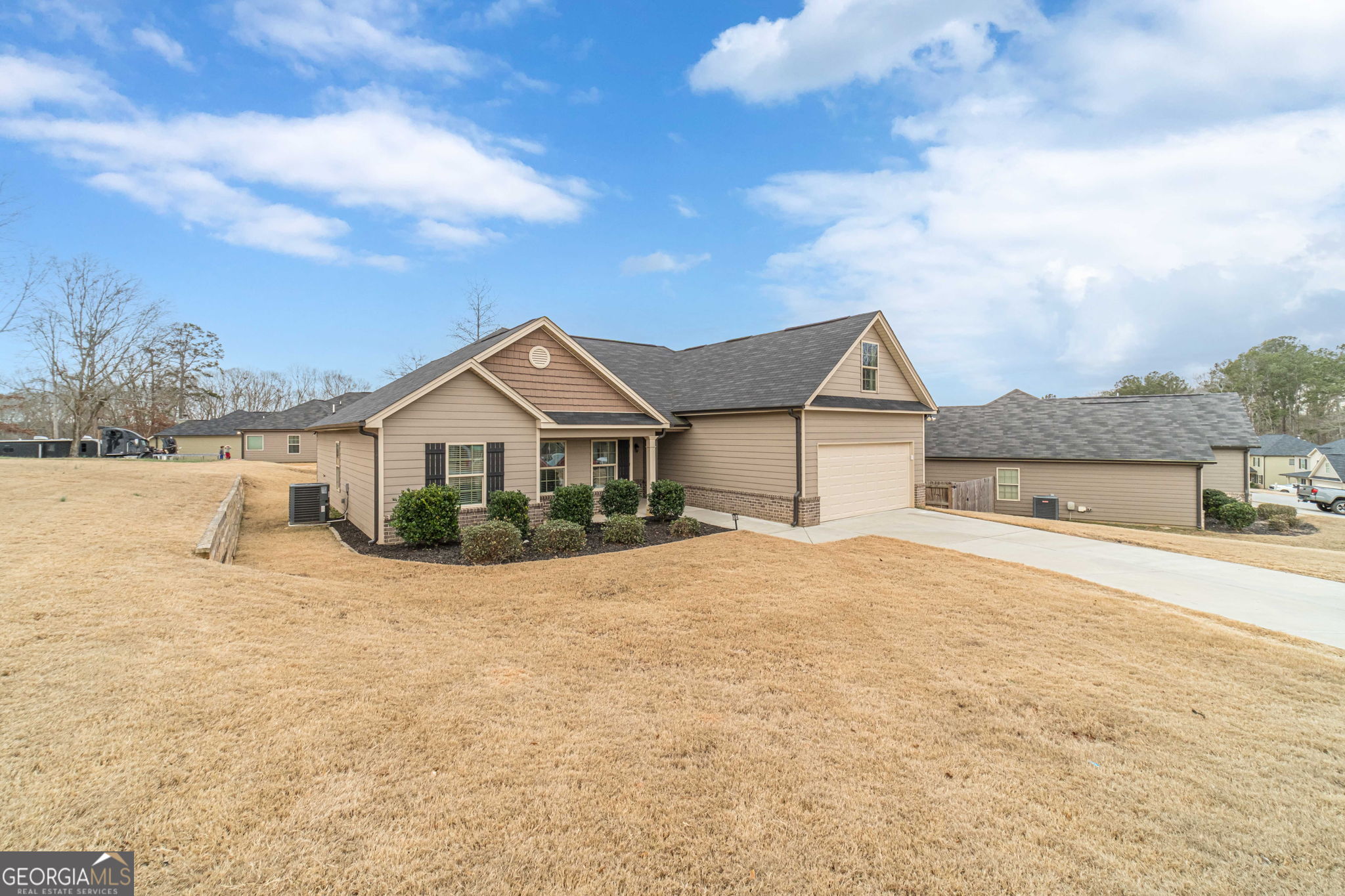 149 Peak Court Winder, GA 30680 - Photo 2 of 27 a front view of a house with a yard and garage