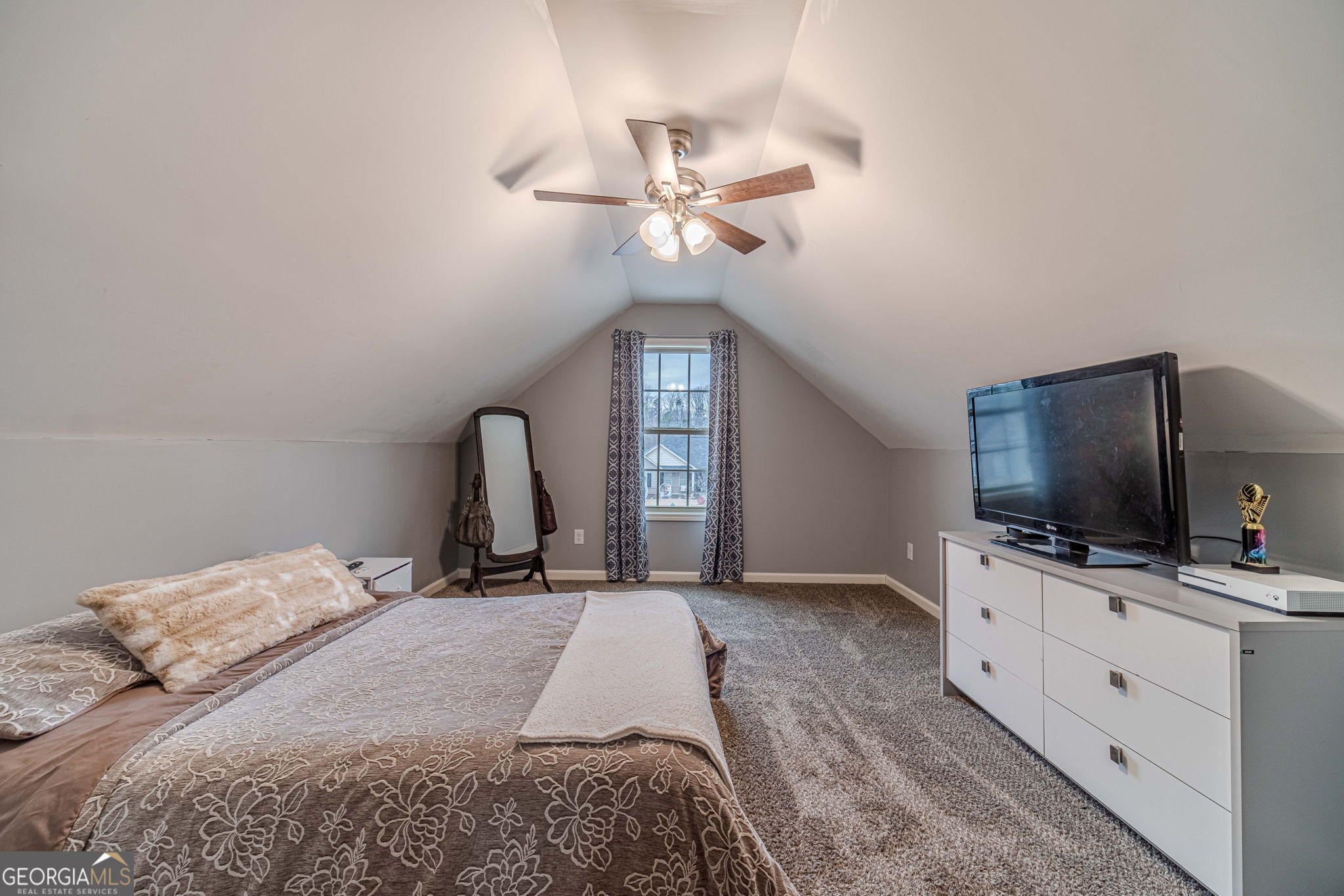149 Peak Court Winder, GA 30680 - Photo 22 of 27 a bedroom with a bed and a flat screen tv