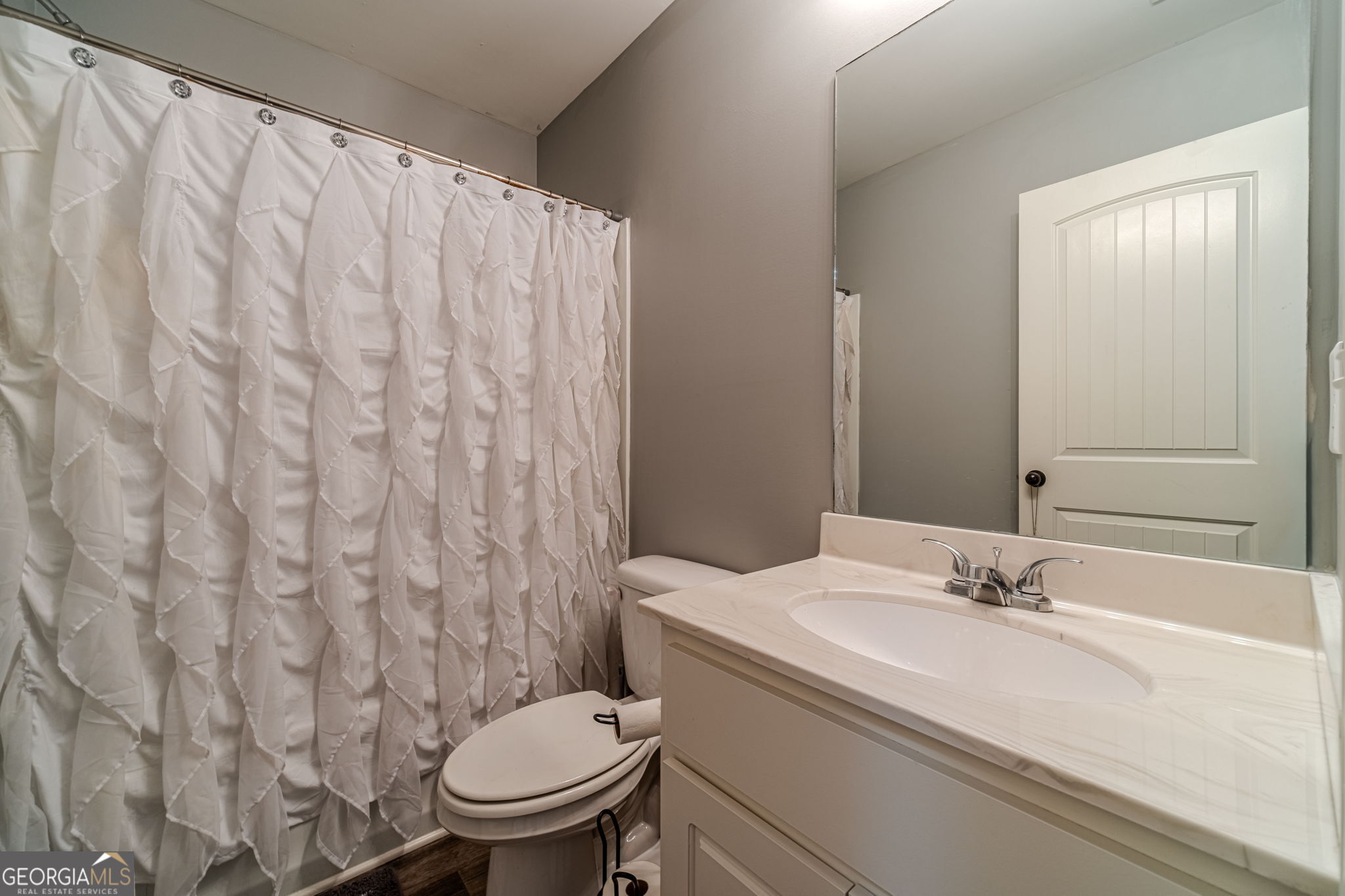 149 Peak Court Winder, GA 30680 - Photo 24 of 27 a bathroom with a sink and a toilet