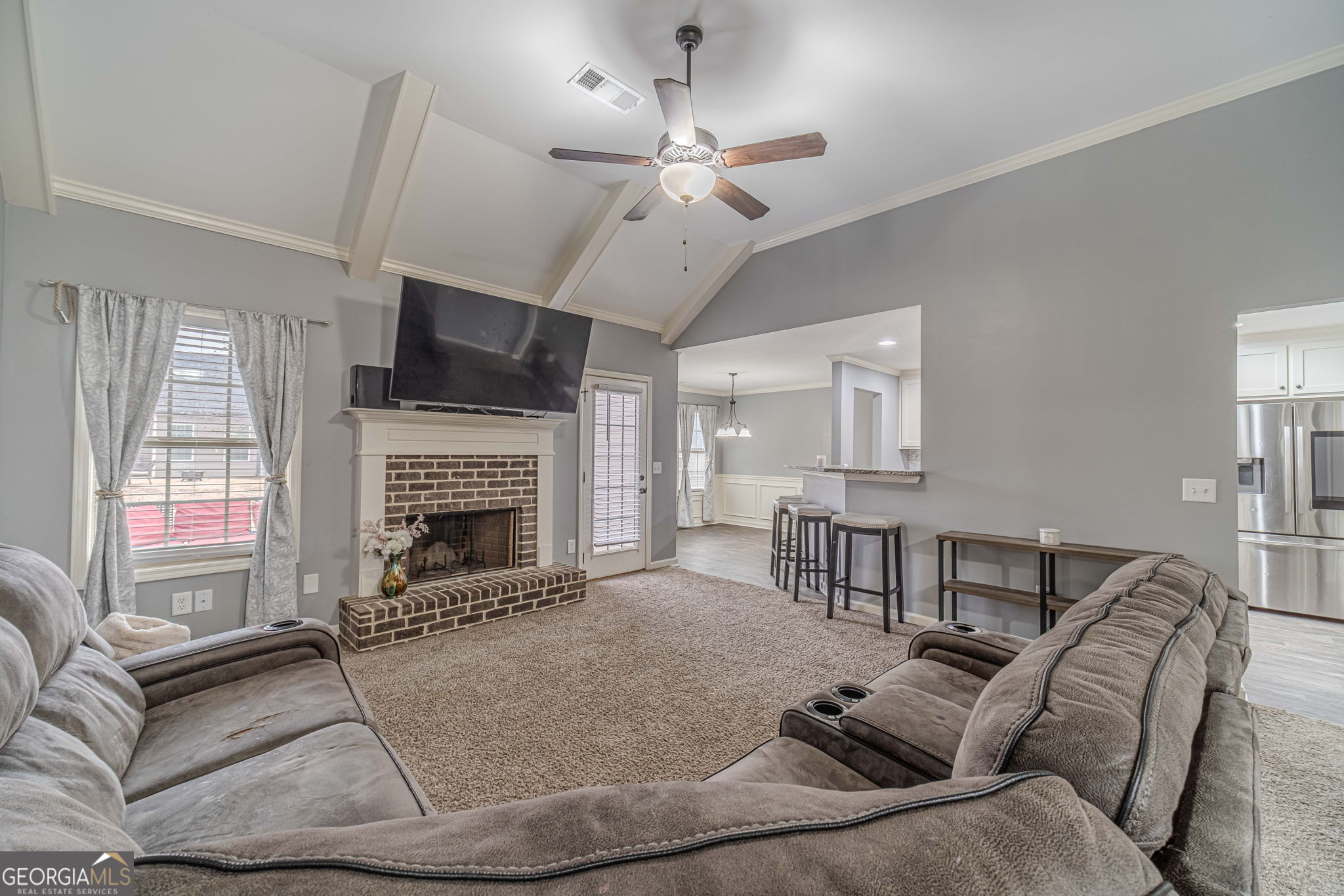 149 Peak Court Winder, GA 30680 - Photo 4 of 27 a living room with furniture fireplace and flat screen tv