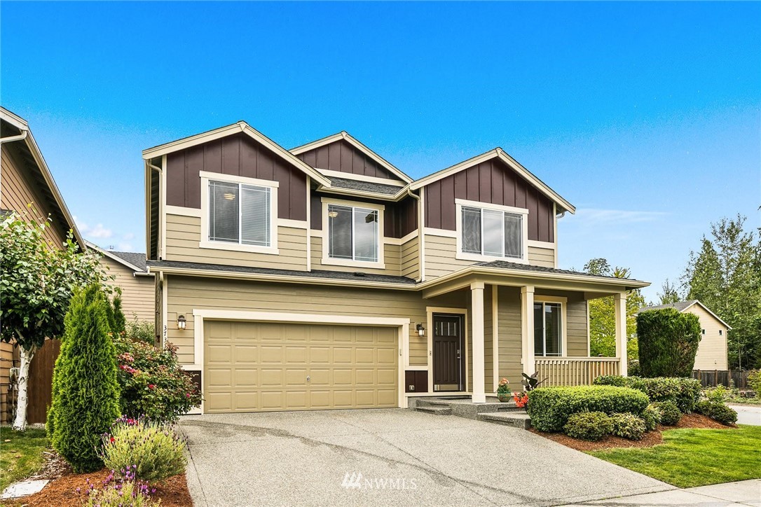 3731 226th Street Southeast Bothell, WA 98021 - Photo 1 of 30 a front view of a house with a yard and garage