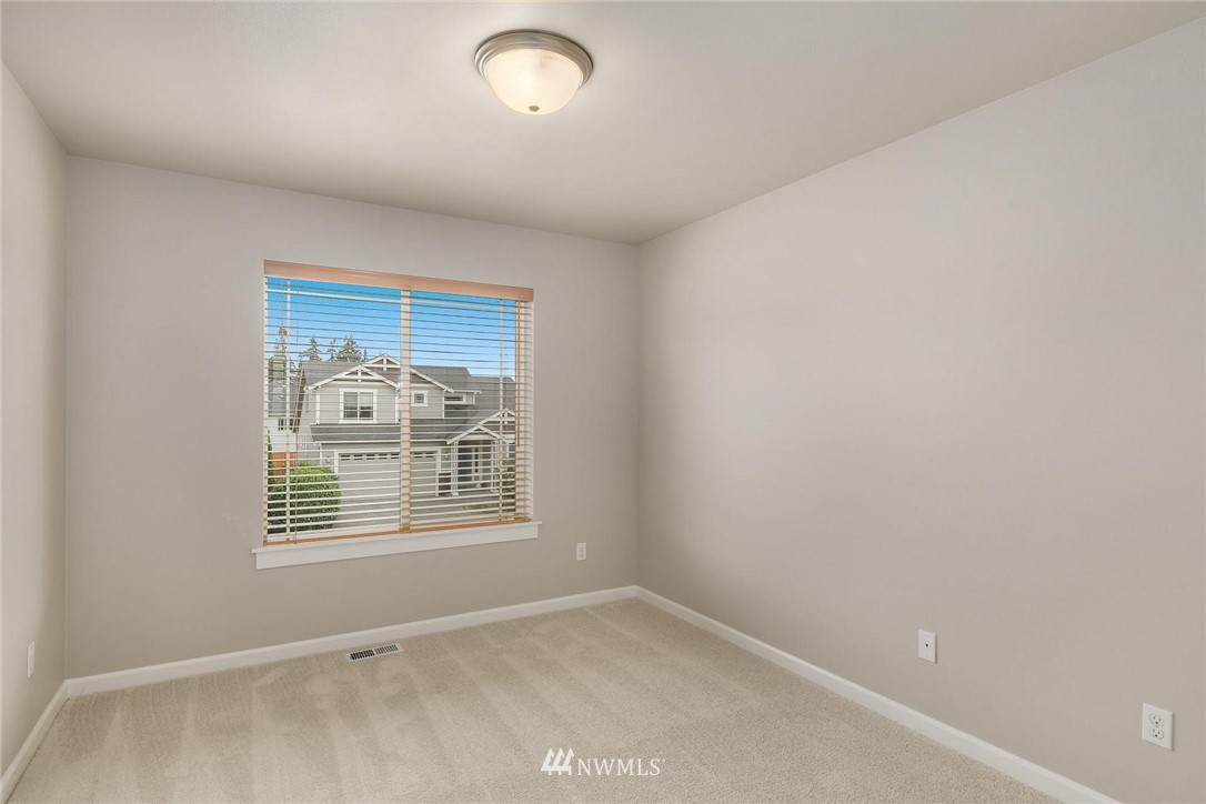 3731 226th Street Southeast Bothell, WA 98021 - Photo 22 of 30 an empty room with windows