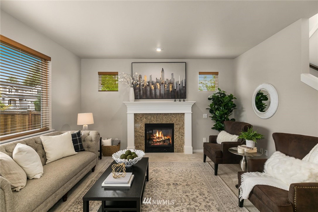 3731 226th Street Southeast Bothell, WA 98021 - Photo 5 of 30 a living room with furniture and a fireplace