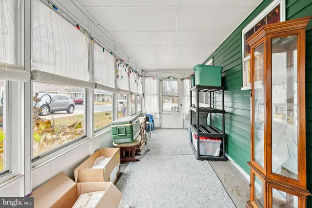 a bed room with a bed and a chandelier