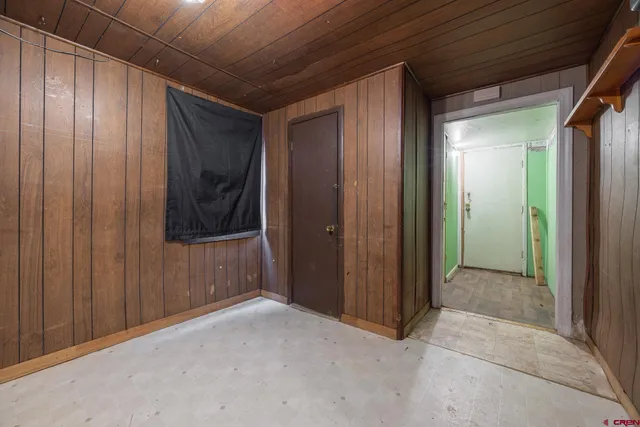 a view of a room with wooden floor