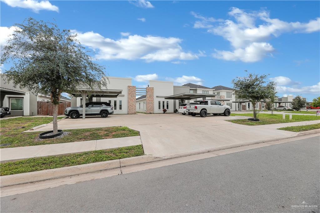 409 Rafael Drive San Juan, TX 78589 - Photo 3 of 20 a car parked on the side of the road
