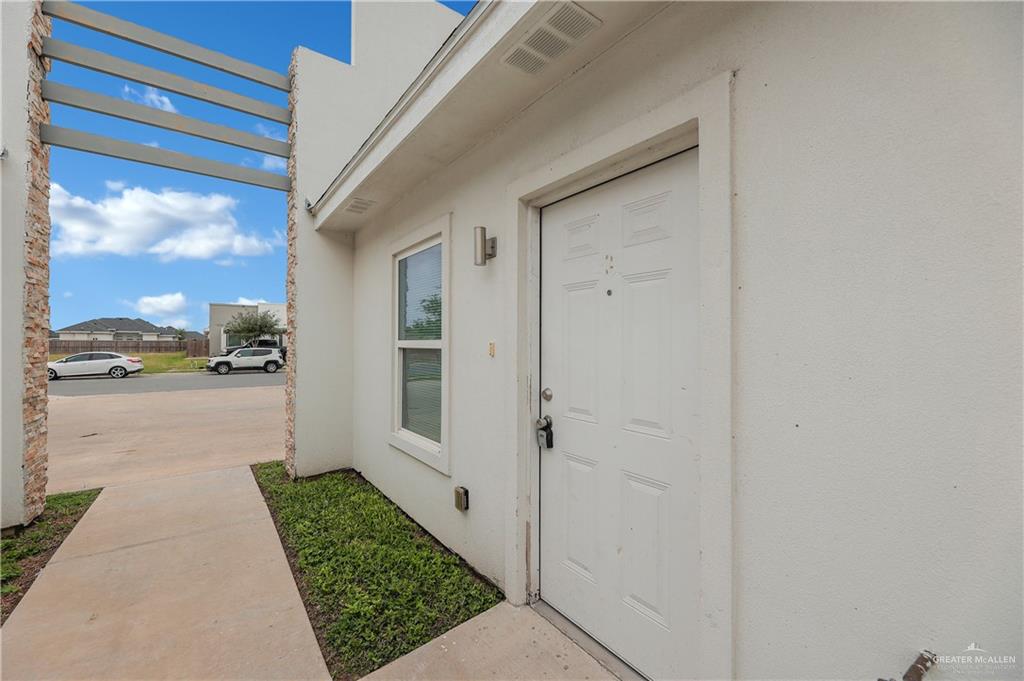 409 Rafael Drive San Juan, TX 78589 - Photo 7 of 20 a view of a car garage door