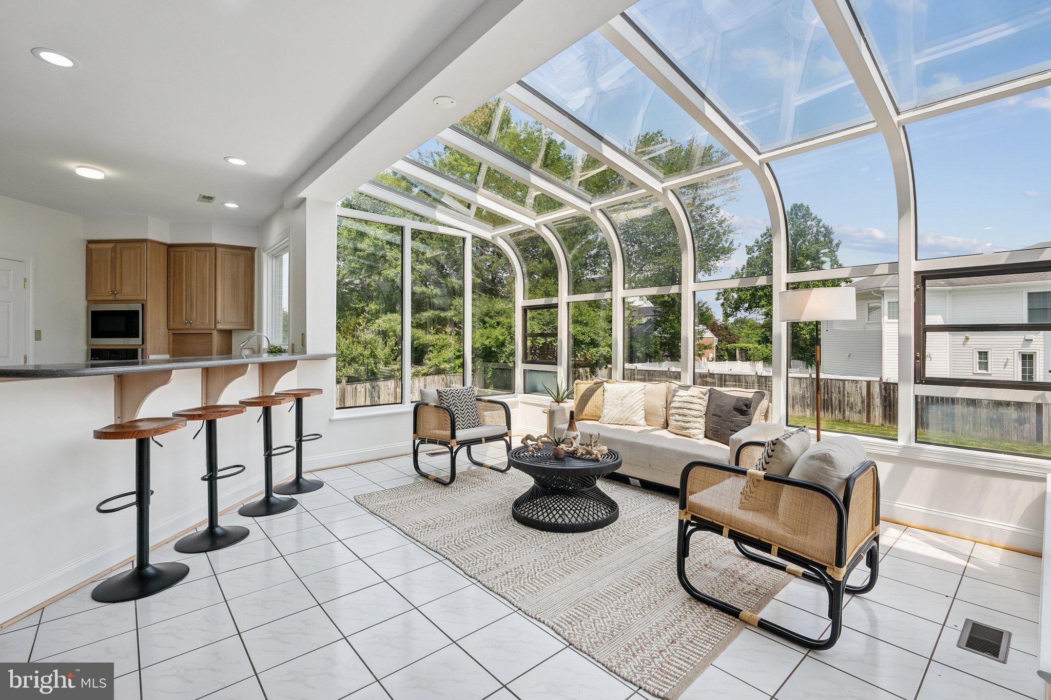9309 Bells Mill Road Potomac, MD 20854 - Photo 11 of 38 a living room with furniture and a large window