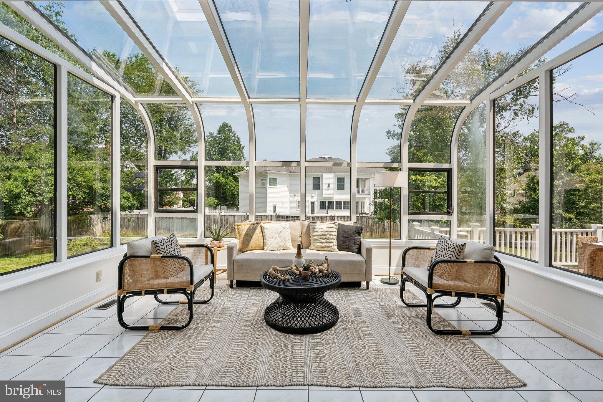 9309 Bells Mill Road Potomac, MD 20854 - Photo 12 of 38 a living room with furniture and floor to ceiling windows