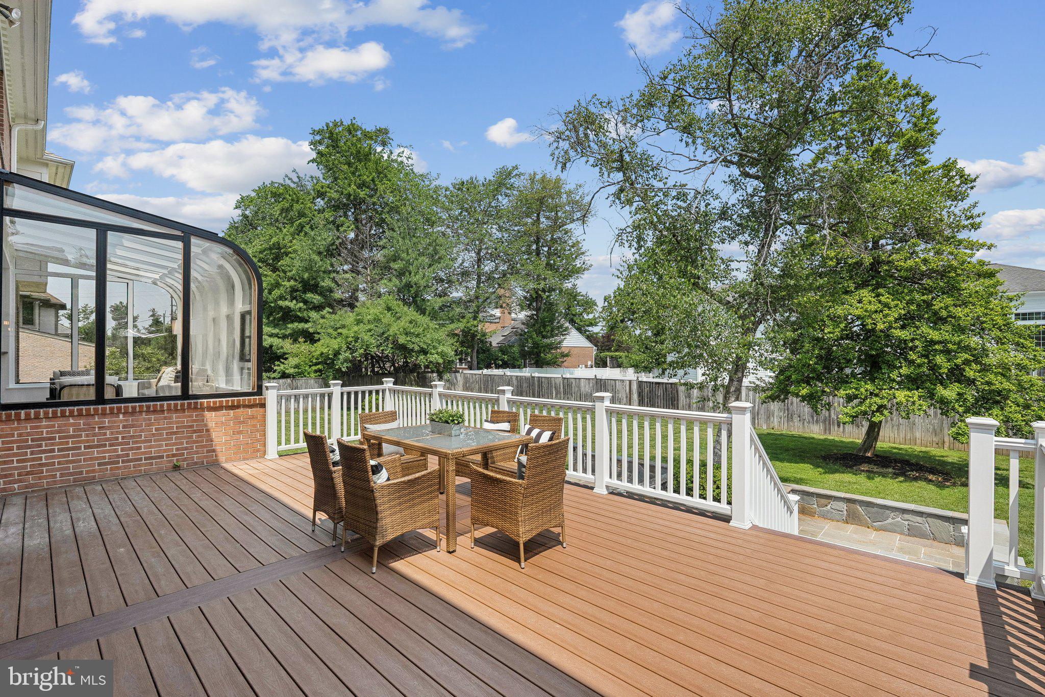 9309 Bells Mill Road Potomac, MD 20854 - Photo 15 of 38 a view of a patio with wooden floor and fence