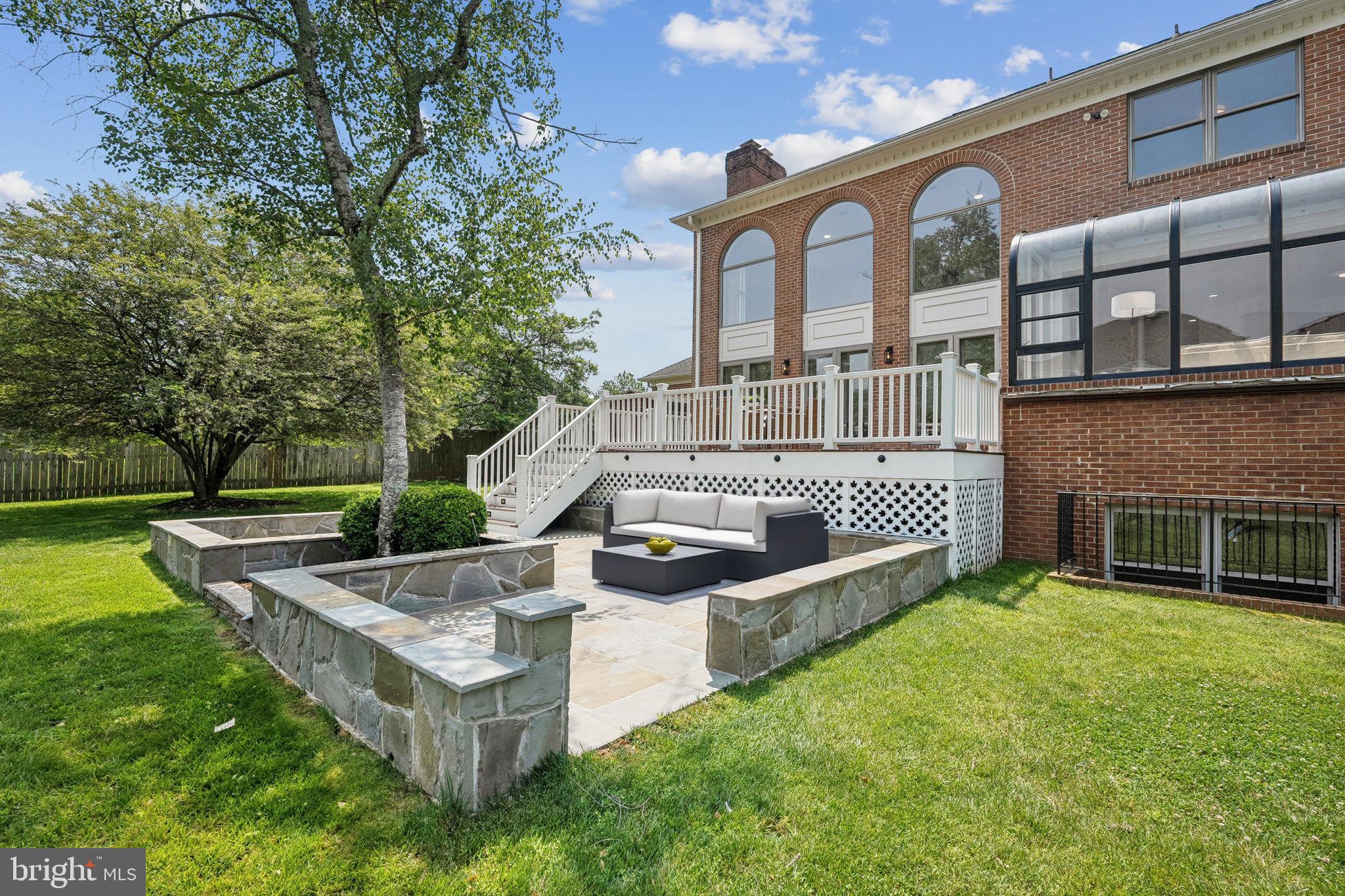 9309 Bells Mill Road Potomac, MD 20854 - Photo 16 of 38 a view of a house with backyard and sitting area