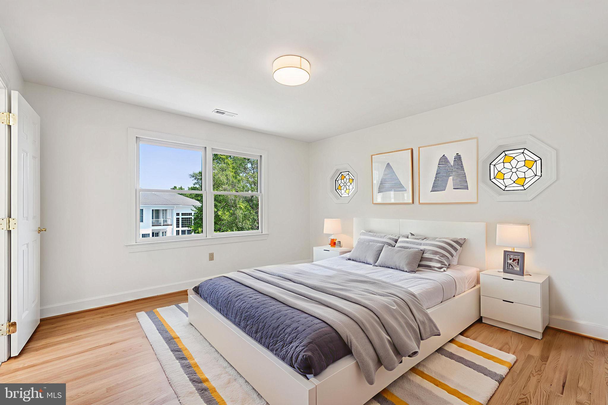 9309 Bells Mill Road Potomac, MD 20854 - Photo 23 of 38 a bedroom with a bed and a window