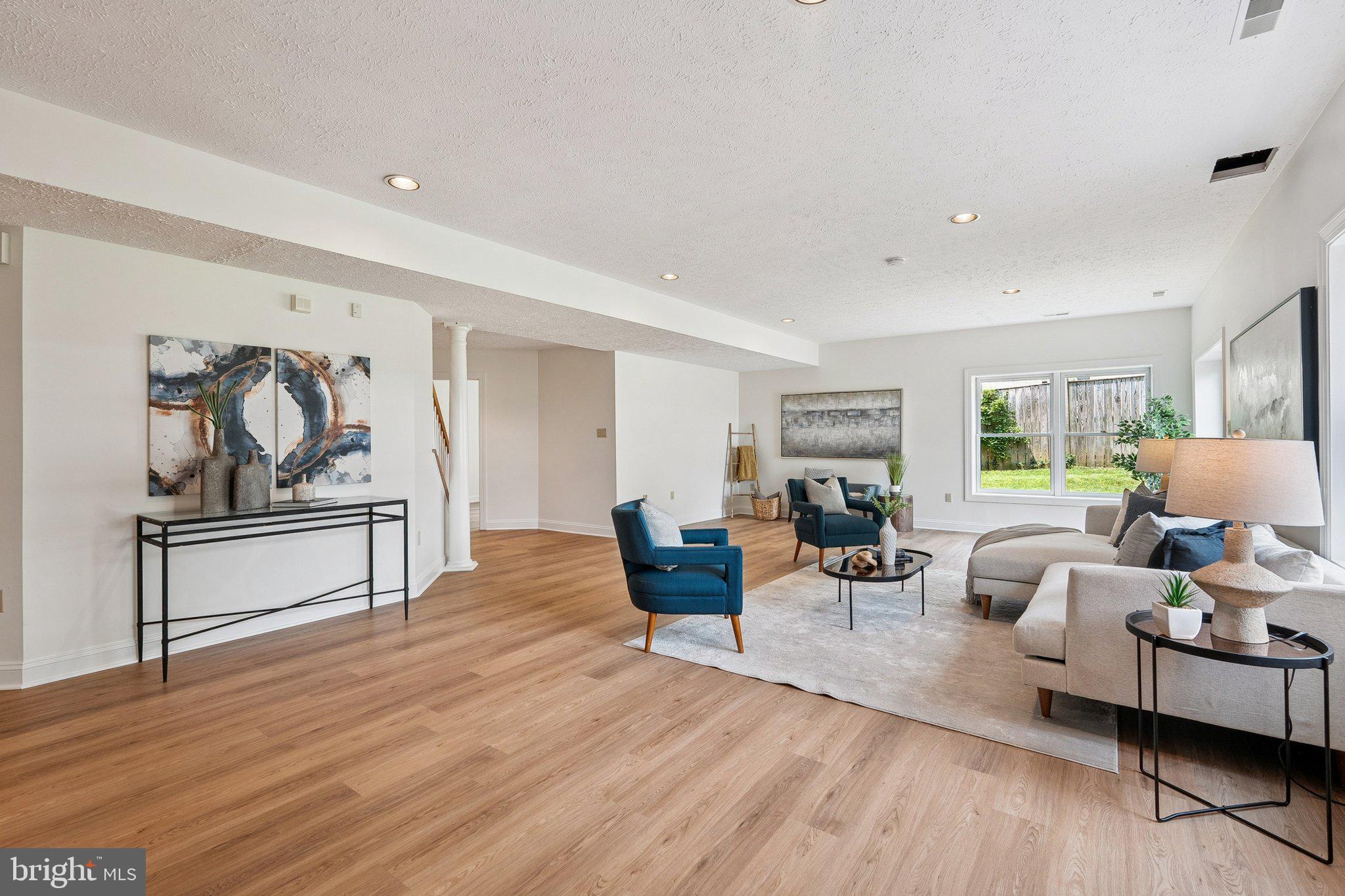 9309 Bells Mill Road Potomac, MD 20854 - Photo 28 of 38 a living room with furniture and wooden floor