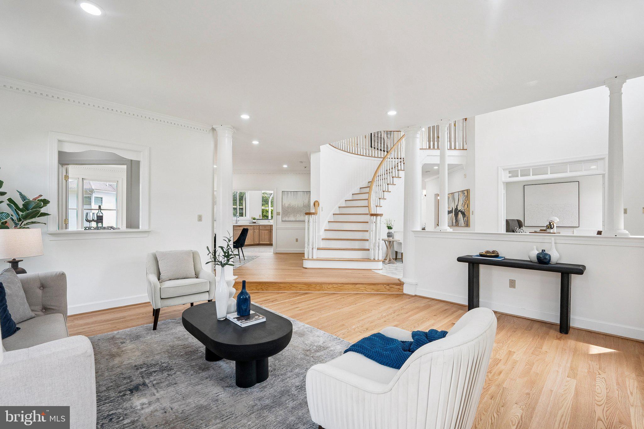 9309 Bells Mill Road Potomac, MD 20854 - Photo 5 of 38 a living room with furniture and wooden floor