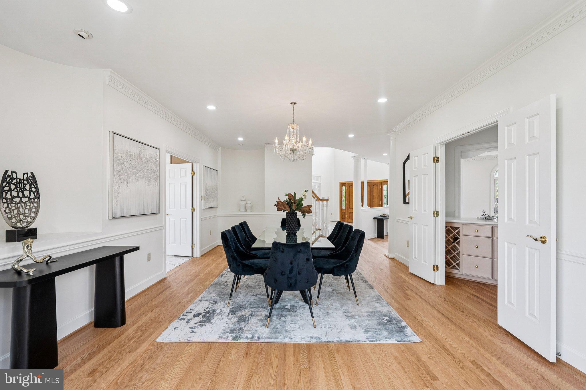 9309 Bells Mill Road Potomac, MD 20854 - Photo 7 of 38 a living room with furniture and a wooden floor