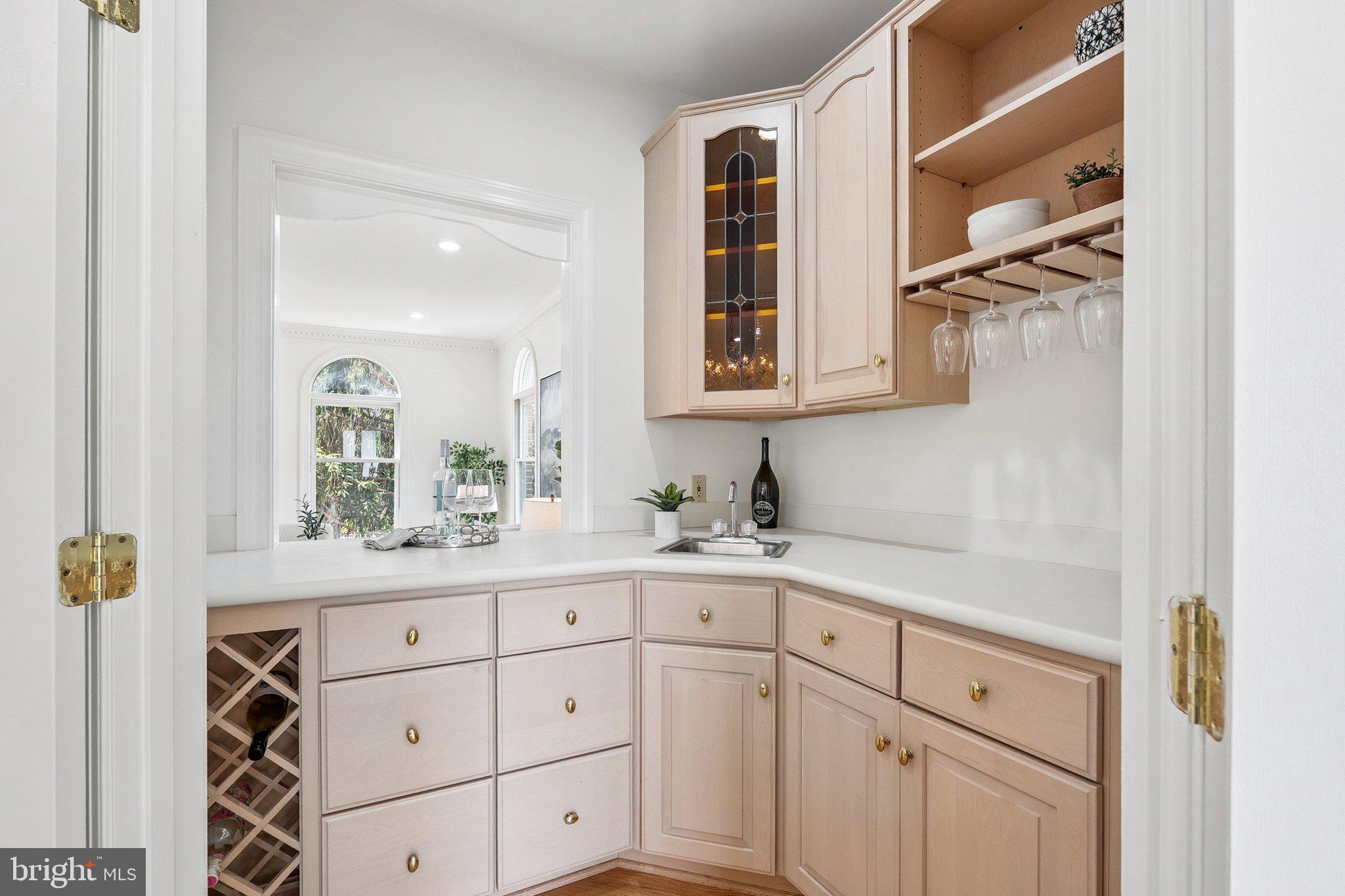 9309 Bells Mill Road Potomac, MD 20854 - Photo 8 of 38 a kitchen with white cabinets and window