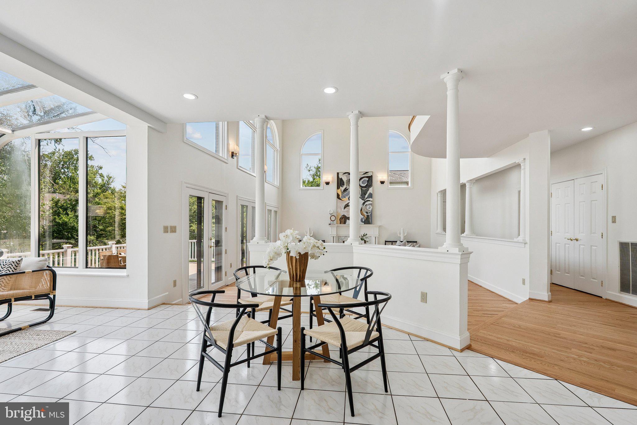 9309 Bells Mill Road Potomac, MD 20854 - Photo 10 of 38 a view of a dining room with furniture window and outside view