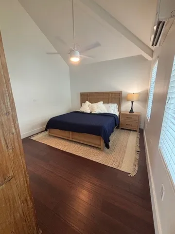 a bedroom with bed and window