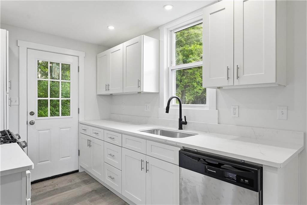 480 Songo Street Pittsburgh, PA 15227 - Photo 15 of 36 a kitchen with appliances cabinets and a window