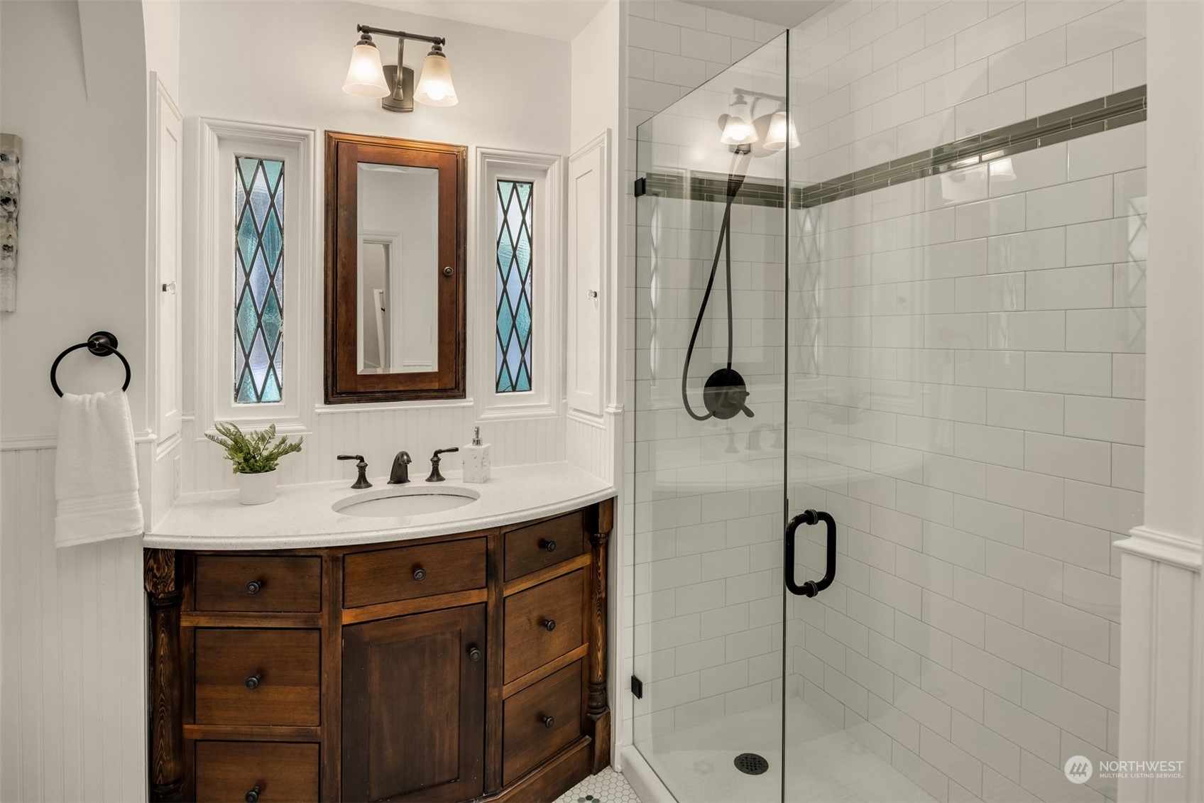 4335 Northeast 45th Street Seattle, WA 98105 - Photo 15 of 37 a bathroom with a sink mirror and shower