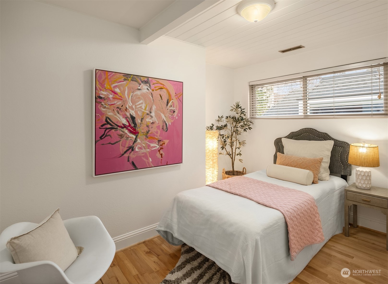 4335 Northeast 45th Street Seattle, WA 98105 - Photo 19 of 37 a bedroom with a bed and a painting on the wall