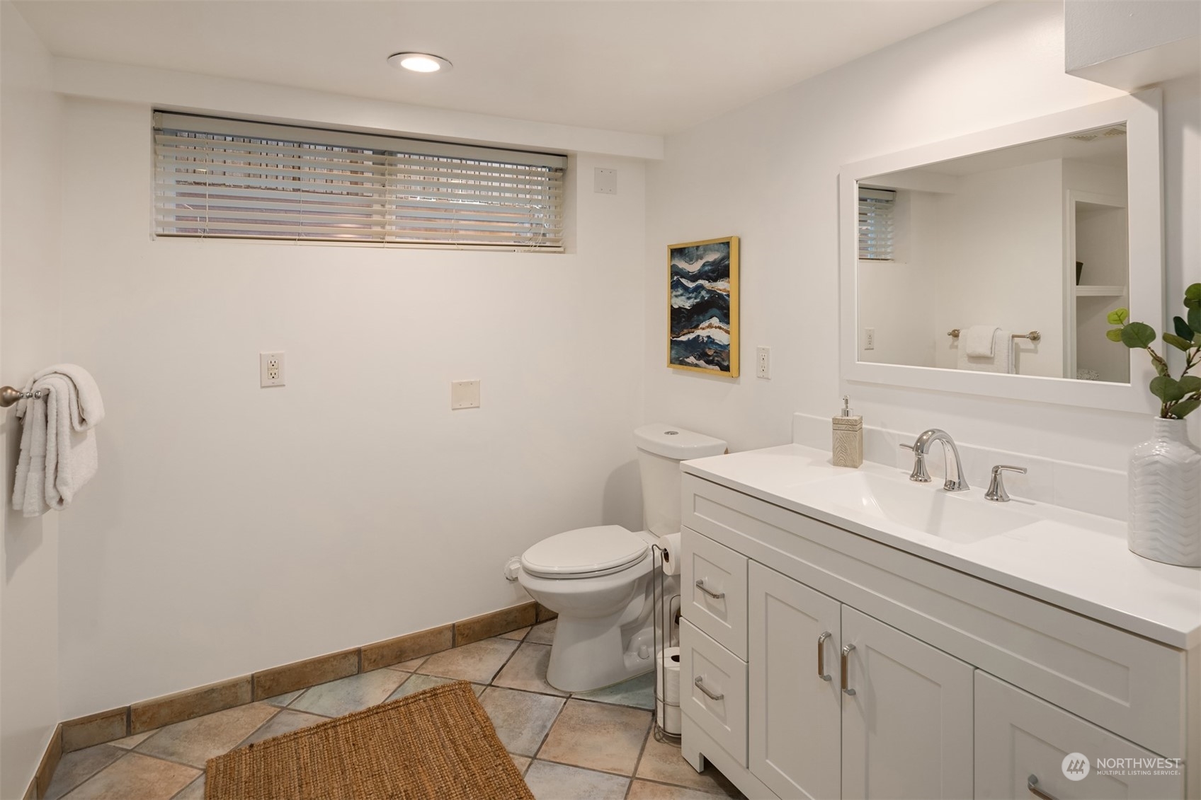 4335 Northeast 45th Street Seattle, WA 98105 - Photo 28 of 37 a bathroom with a toilet sink and mirror