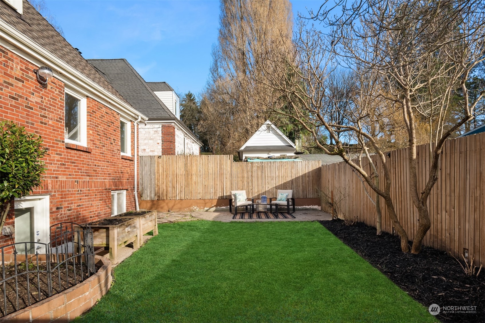 4335 Northeast 45th Street Seattle, WA 98105 - Photo 31 of 37 a view of backyard of house with green space