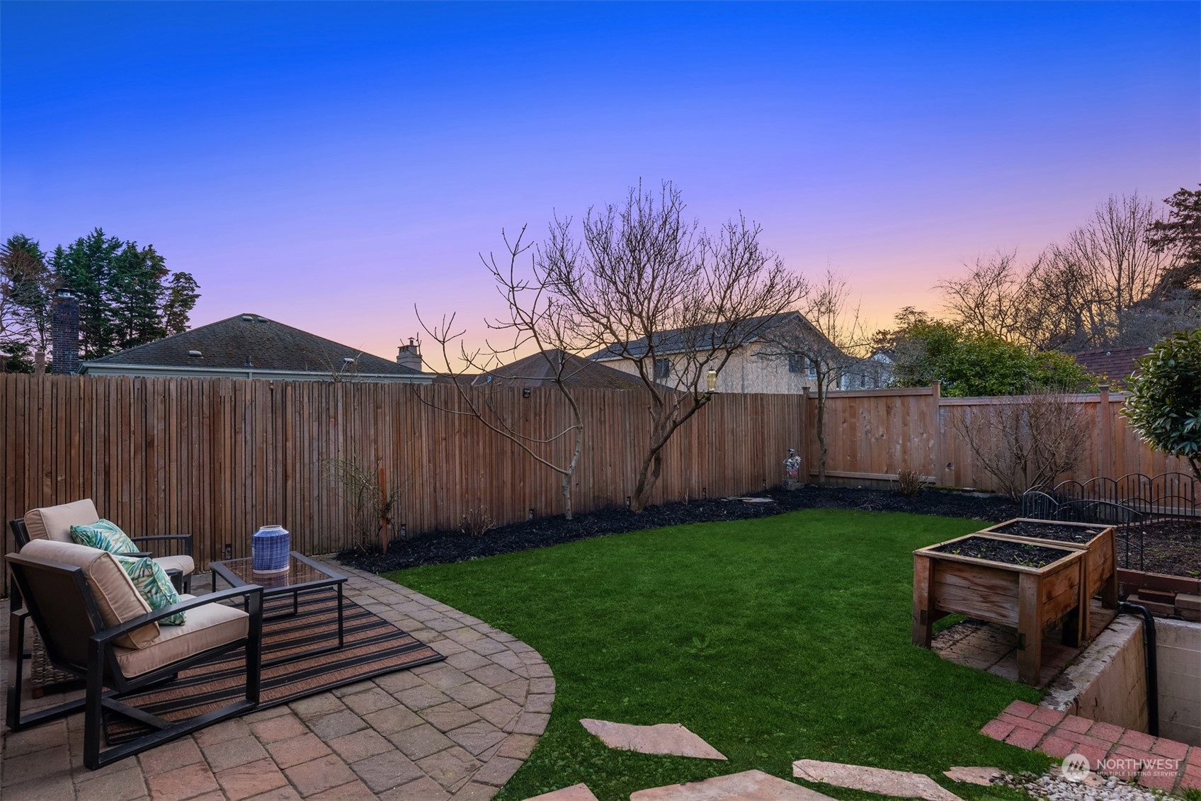 4335 Northeast 45th Street Seattle, WA 98105 - Photo 33 of 37 a view of a backyard with wooden fence and a bench
