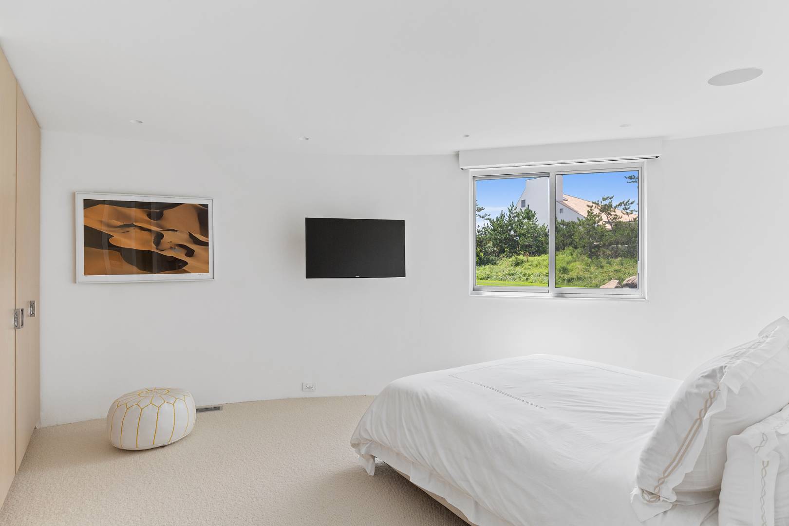 Undisclosed Address Southampton, NY 11968 - Photo 14 of 43 a bedroom with a bed and a window