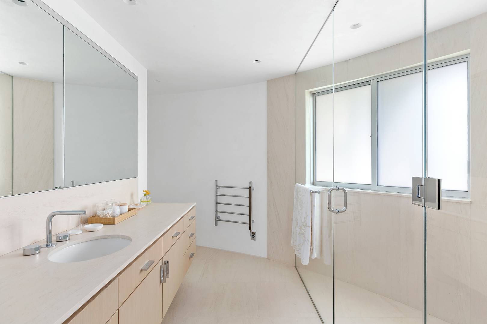 Undisclosed Address Southampton, NY 11968 - Photo 15 of 43 a bathroom with a double vanity sink and a mirror